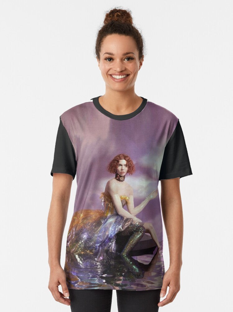 Graphic T-shirt featuring the name "SOPHIE" in an iridescent, ethereal design with LGBTQ+ and electronic music themes. - Women