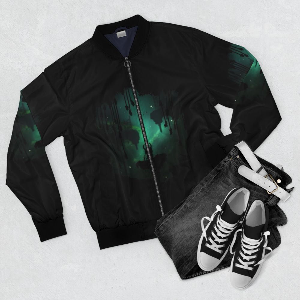 A bomber jacket with a nature-inspired design, featuring elements from the popular video game Hollow Knight. - Flat lay