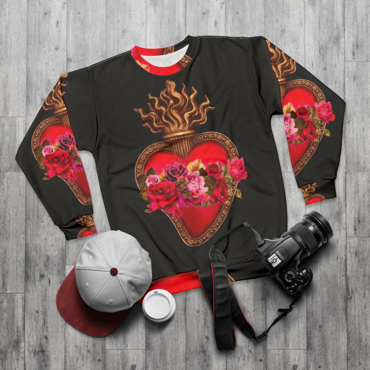 Vibrant sacred heart and immaculate heart red flaming heart design on a red sweatshirt - flat lay