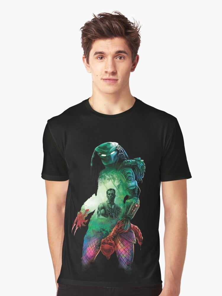 A graphic t-shirt featuring the Predator, a hunter from outer space, stalking its prey in the jungle. - Men