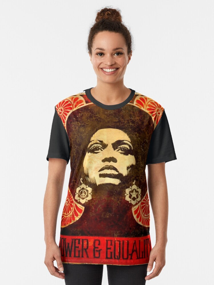 Vintage-style graphic t-shirt featuring Angela Davis, a prominent leader of the Black Panther Party in 1971, and the powerful "Black Power" fist symbol. - Women