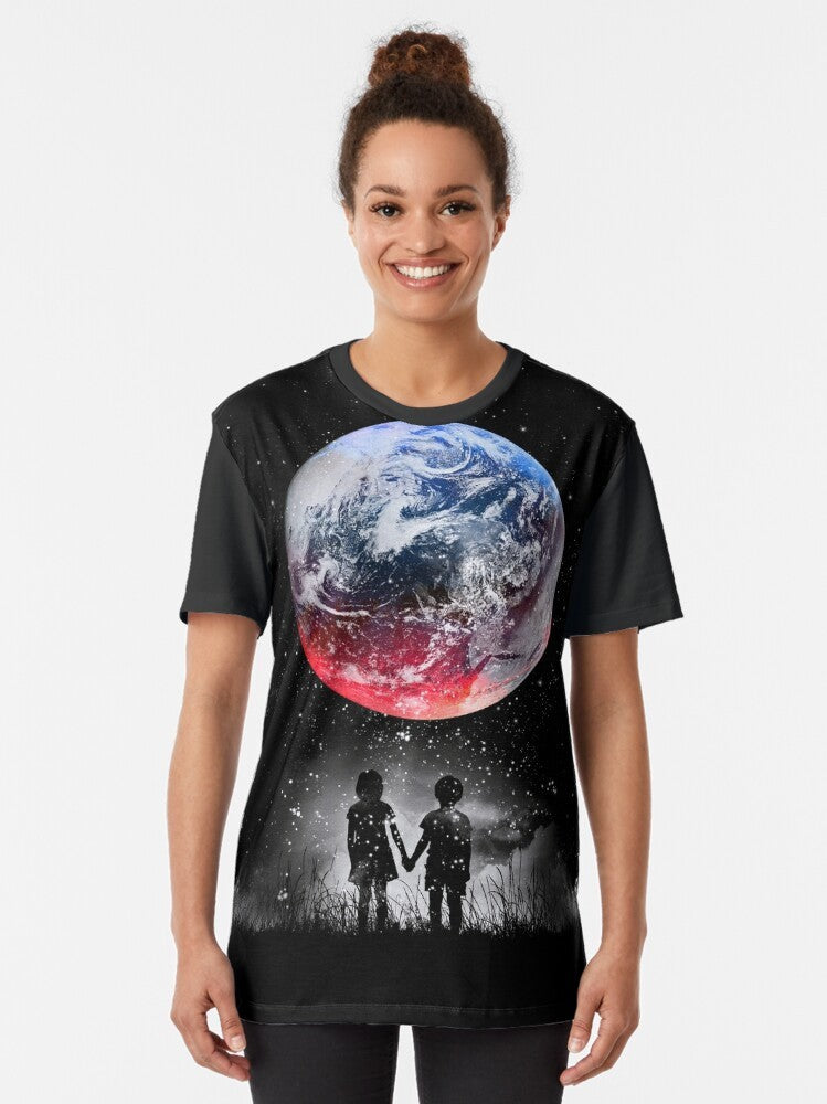 Graphic t-shirt featuring a space and universe design with stars, planets, and earth - Women