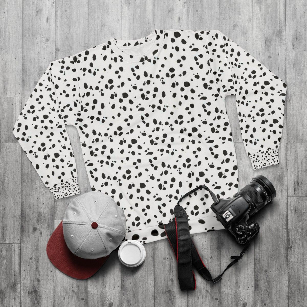 Dalmatian print sweatshirt with cute black and white spot pattern - flat lay