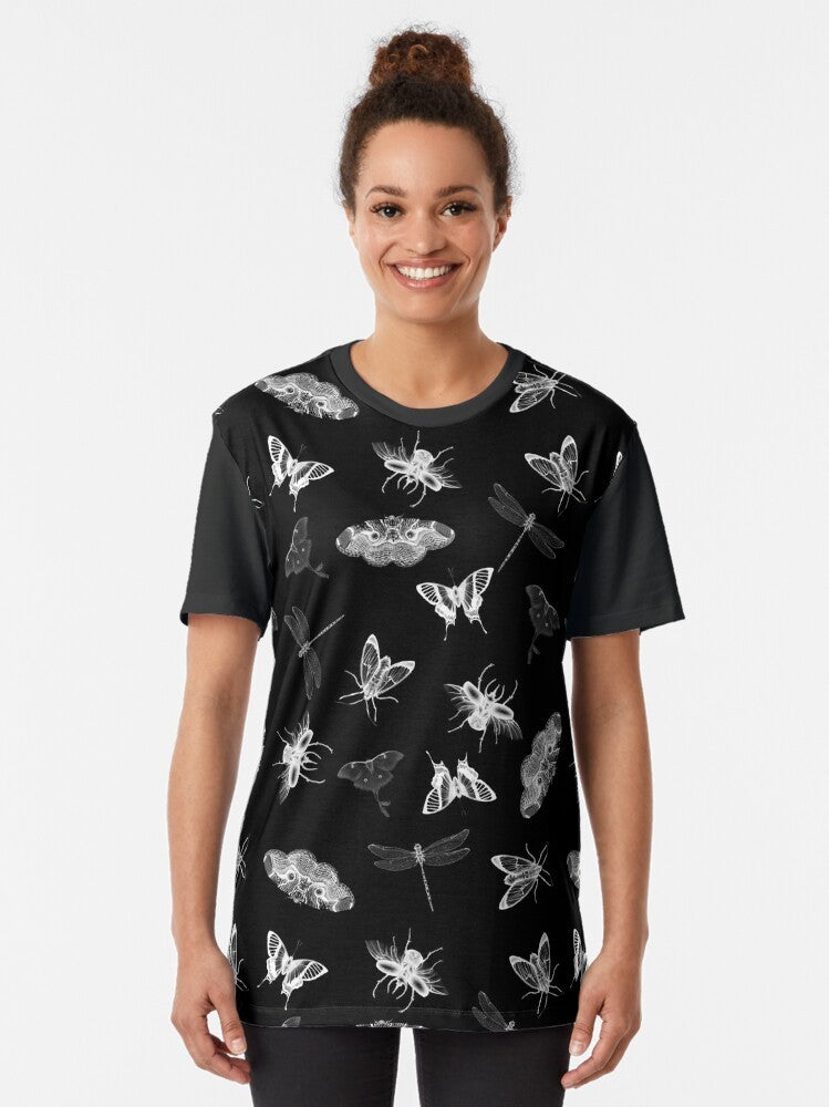 A black and white graphic t-shirt design featuring a pattern of various insects and bugs, including moths, butterflies, and dragonflies, for an entomology-inspired nightmare. - Women