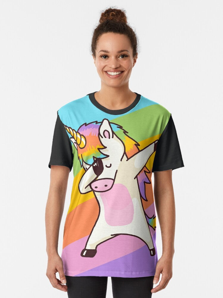 A graphic t-shirt featuring a dabbing unicorn wearing sunglasses and a hip hop-inspired design. - Women