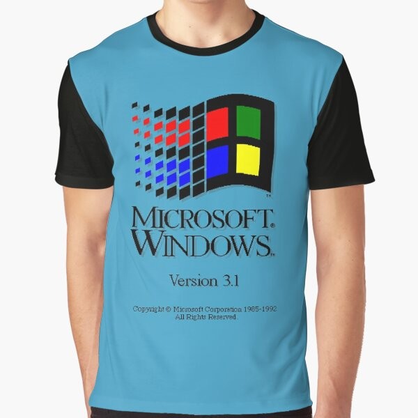 A vintage-style graphic t-shirt featuring the Windows 3.1 operating system logo, evoking nostalgic memories of retro Microsoft gaming and computing in the 90s.