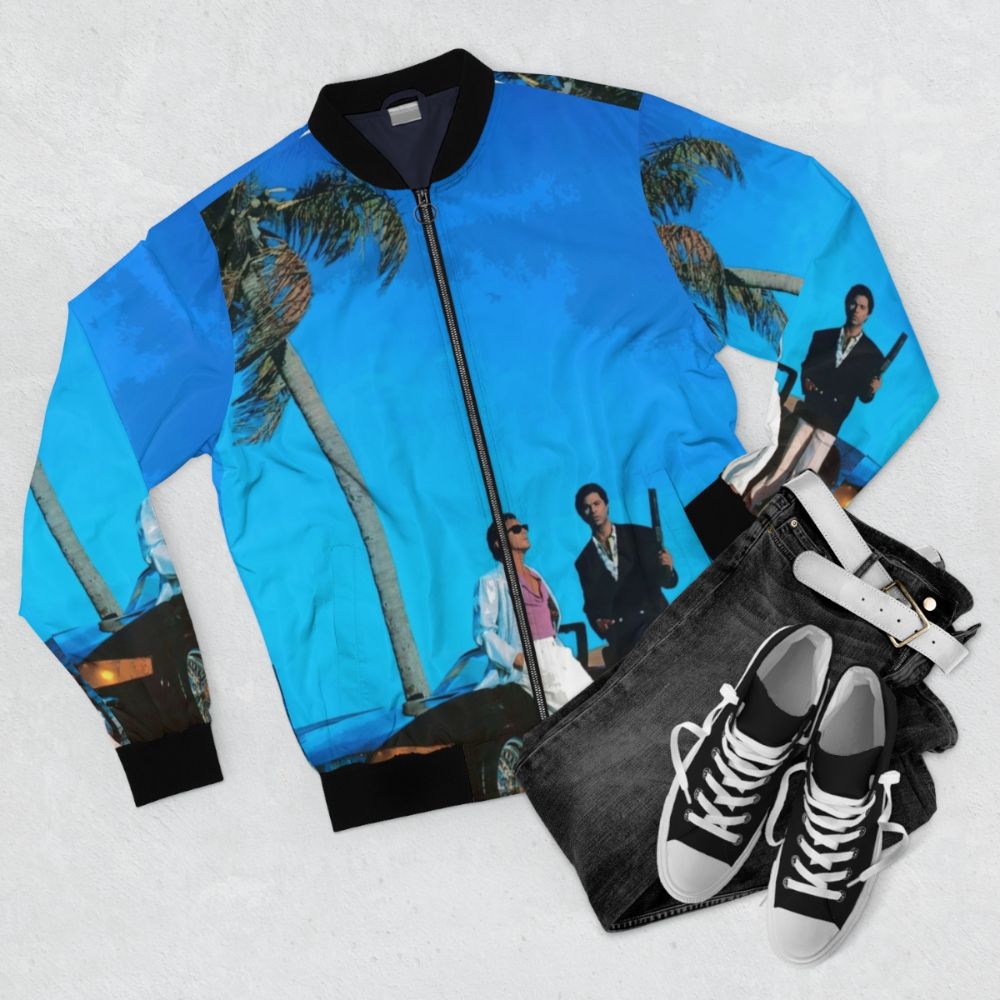 Miami Vice inspired retro bomber jacket featuring a blue illustration - Flat lay