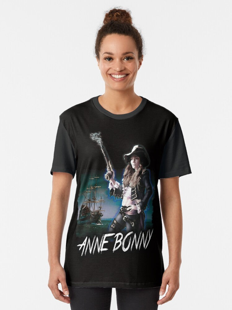 A graphic t-shirt featuring the powerful pirate queen Anne Bonny from the Black Sails TV series. - Women