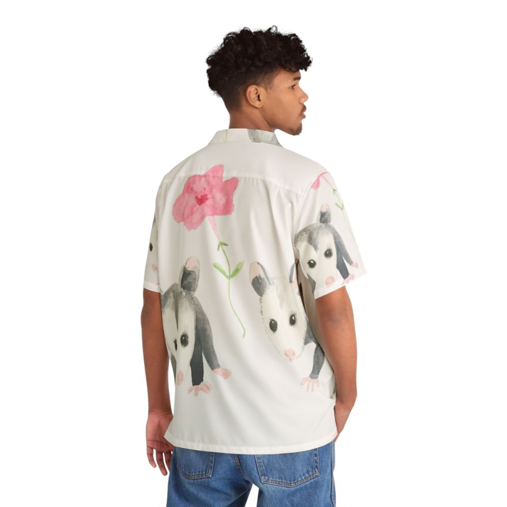 Cute baby opossum and pink petunias on a Hawaiian-style shirt - Flat lay