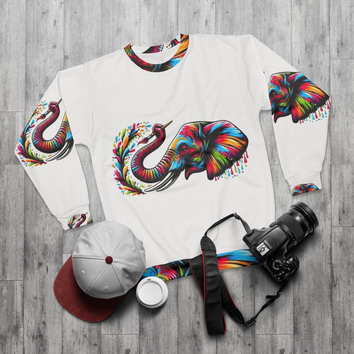 Colorful elephant painting on a cozy sweatshirt - flat lay