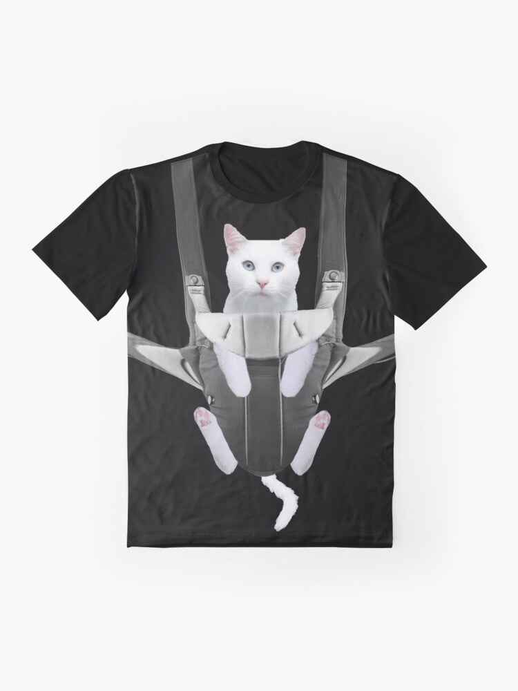 Adorable tabby cat snuggled in a baby carrier on a graphic t-shirt - Flat lay