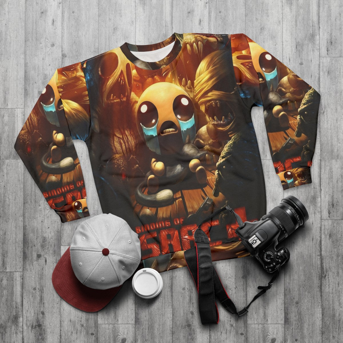 The Binding Of Isaac Sweatshirt featuring key characters from the popular videogame - flat lay