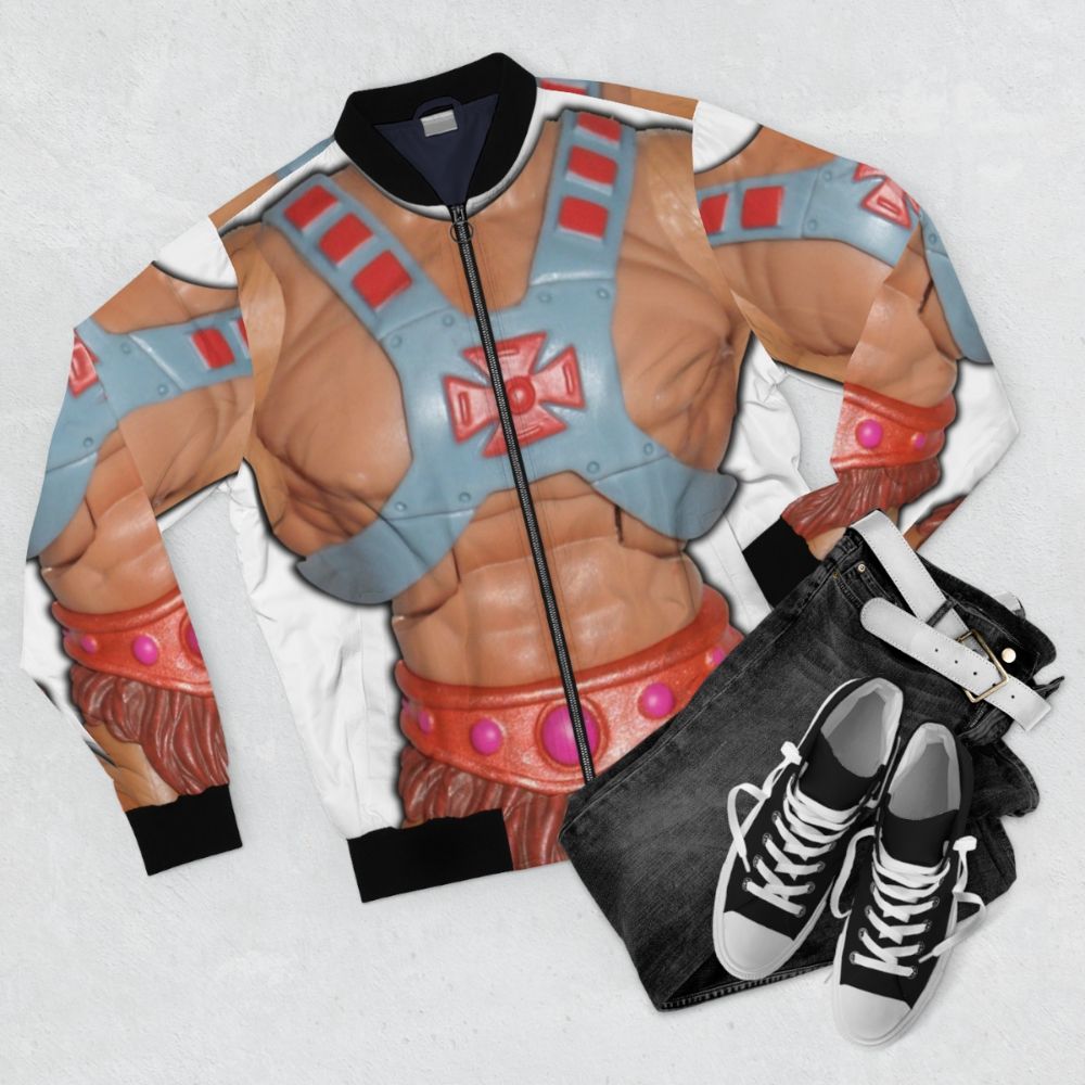 Vintage-style bomber jacket with a retro He-Man action figure graphic - Flat lay