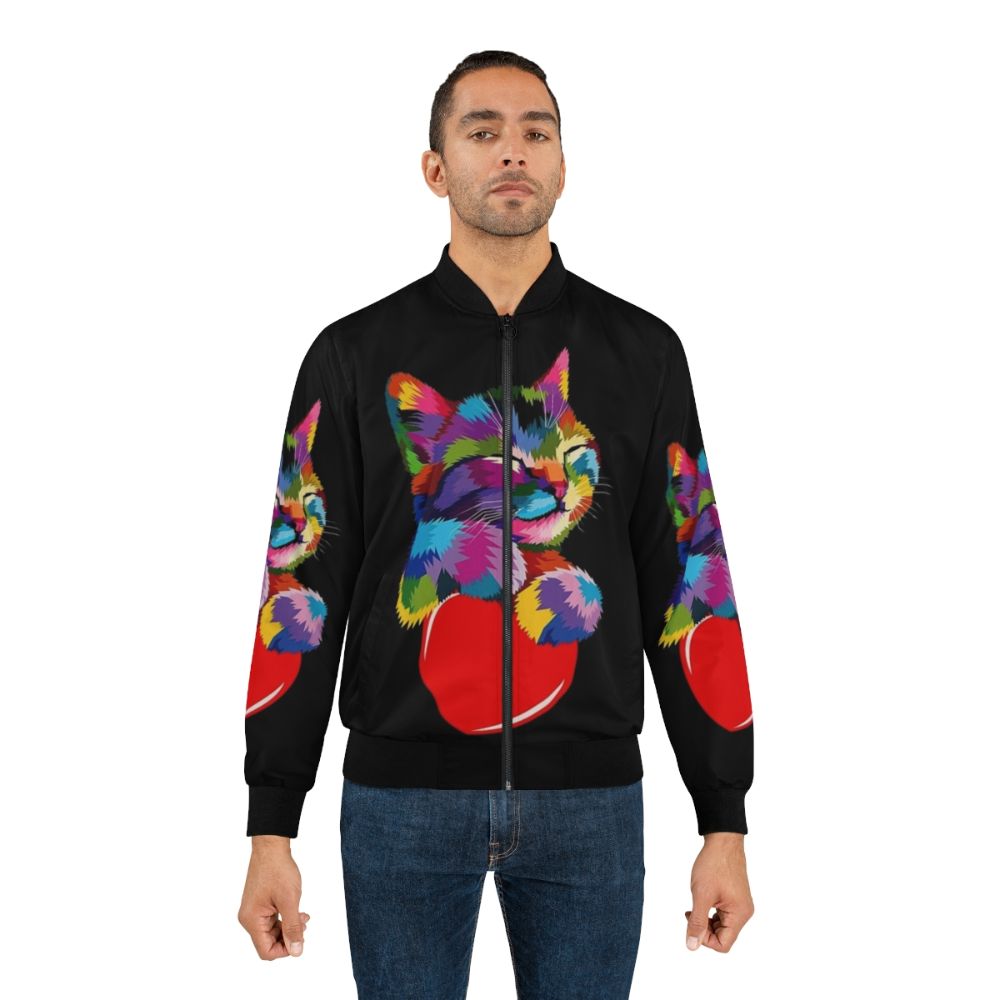 A vibrant and stylish bomber jacket featuring a colorful cat hugging a heart design. - Lifestyle