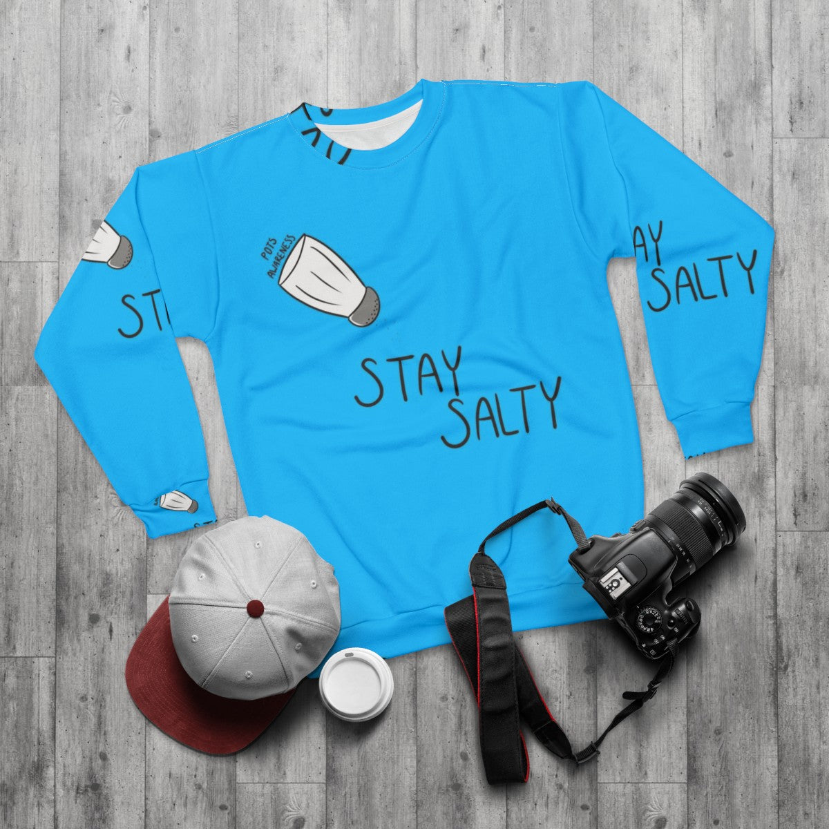 Stay Salty POTS Awareness Sweatshirt featuring a blue design with text - flat lay