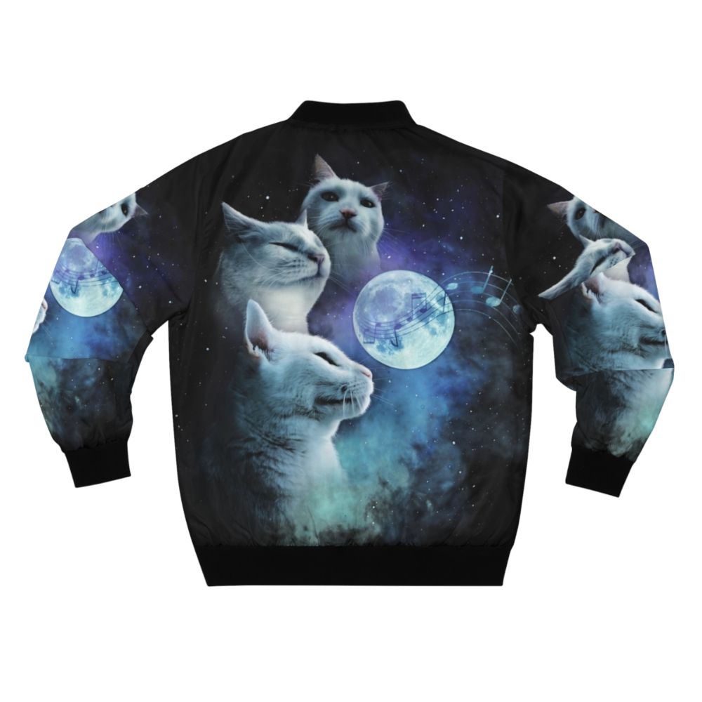 A bomber jacket featuring a vibrant design of cats vibing against a cosmic galaxy background, with a three-cat moon motif. - Back