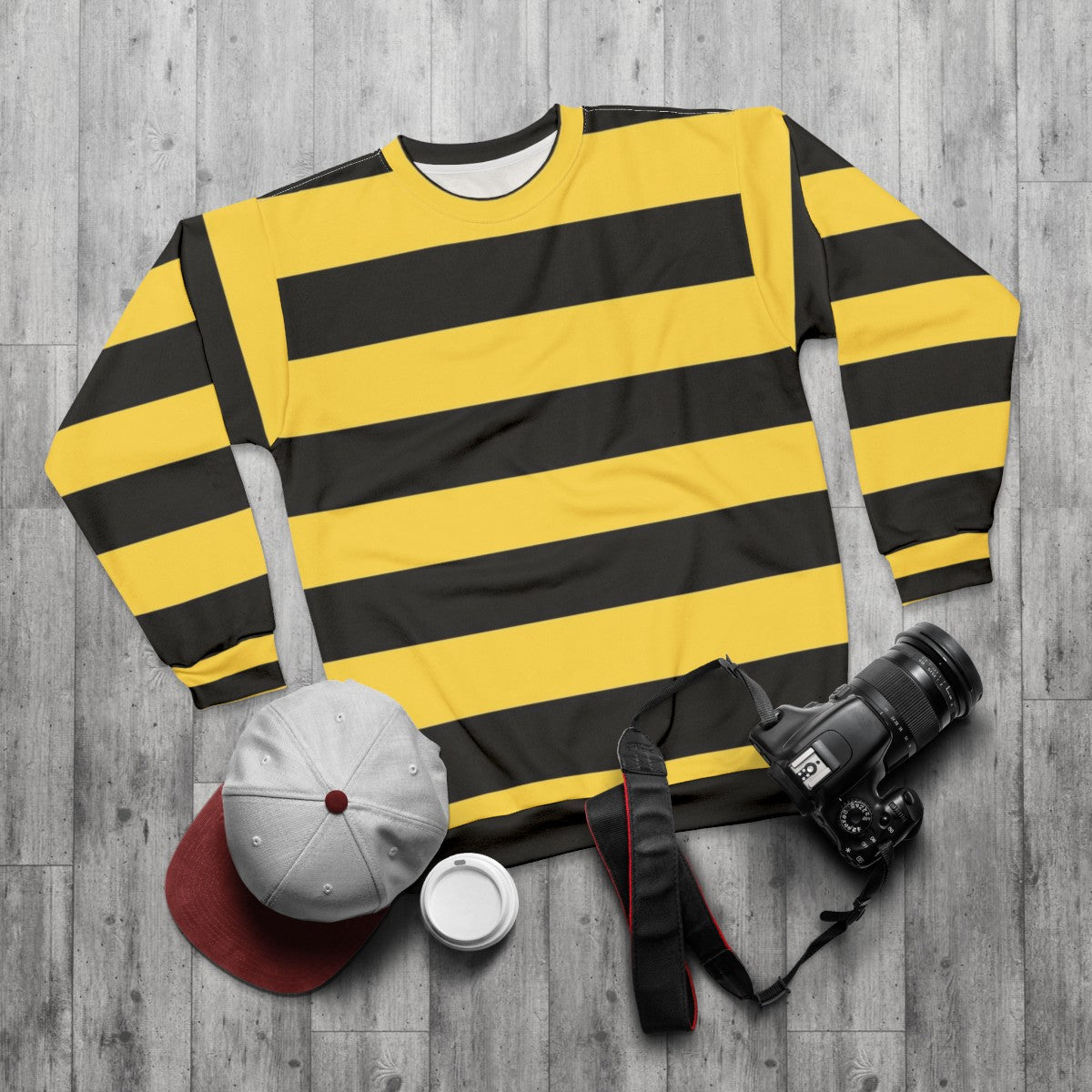 Bumble bee sweatshirt with bright yellow and black contrasting patterns - flat lay