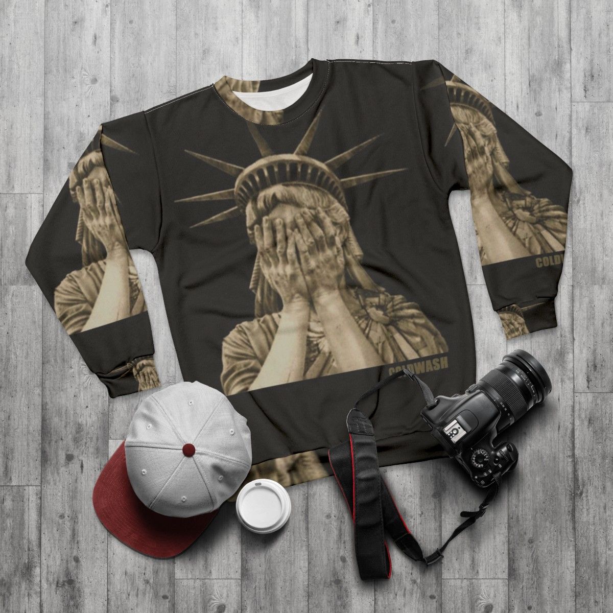 Woman wearing a Lady Liberty graphic sweatshirt - flat lay