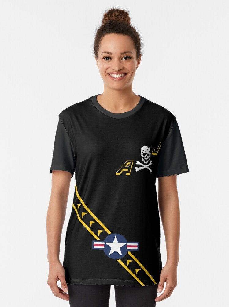 VF84 Jolly Rogers graphic t-shirt with navy, yellow, and black design featuring F14 Tomcat aircraft, skull and bones insignia, and military aviation theme. - Women