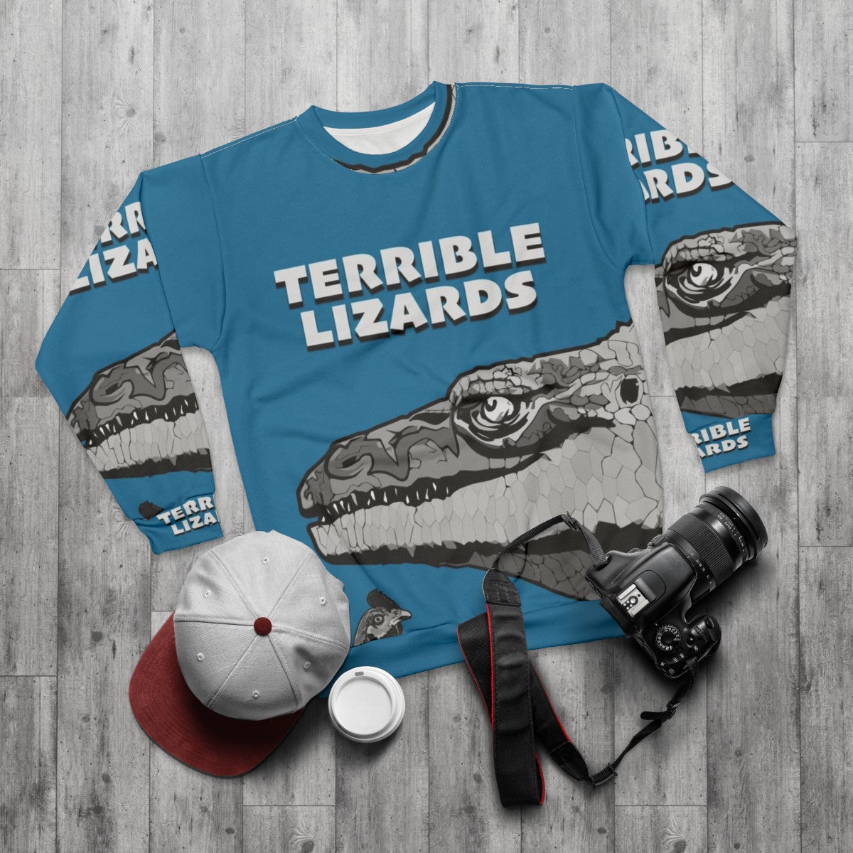 Prehistoric dinosaur sweatshirt with "Terrible Lizards" design - flat lay