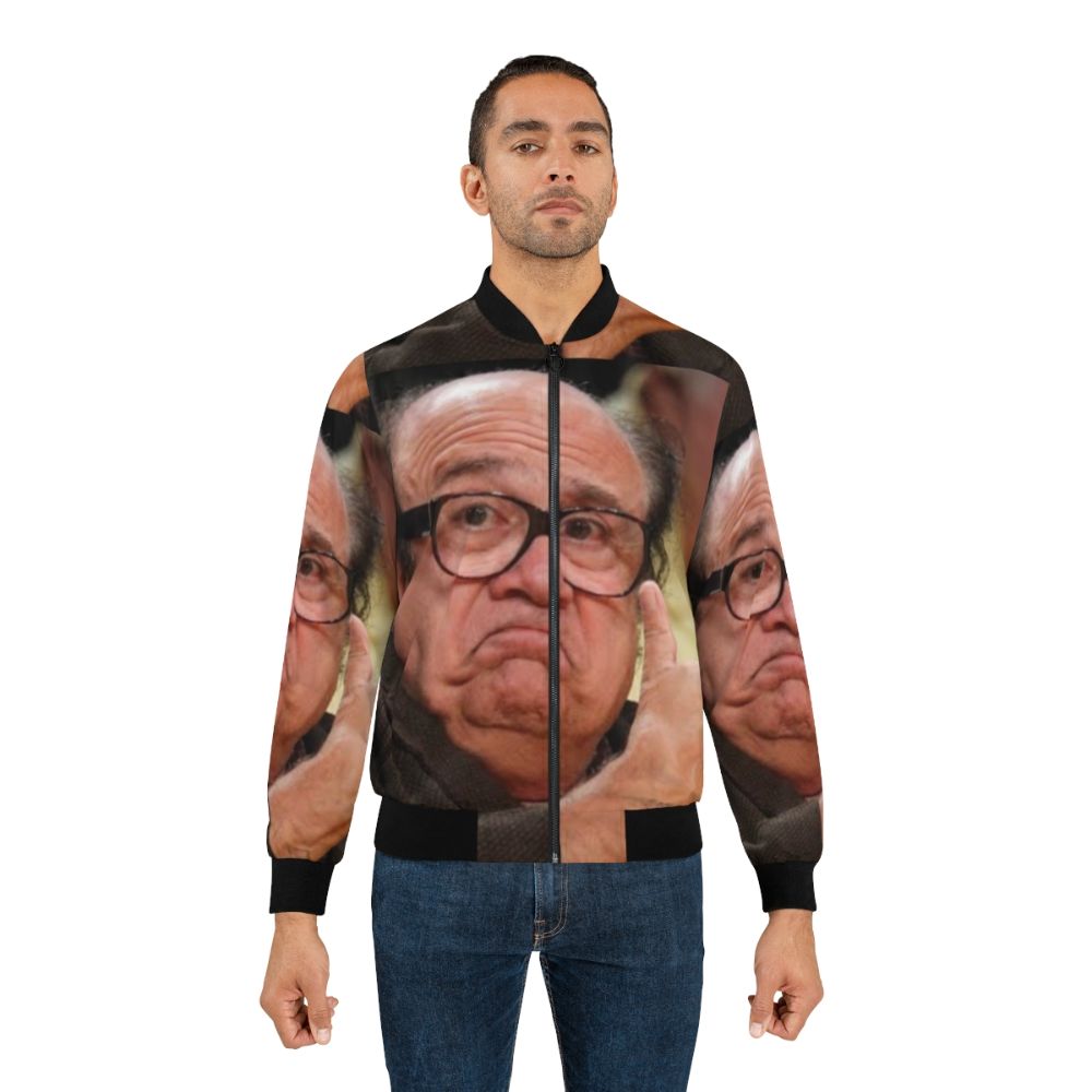 Danny Devito in a bomber jacket, smiling and approving the design - Lifestyle