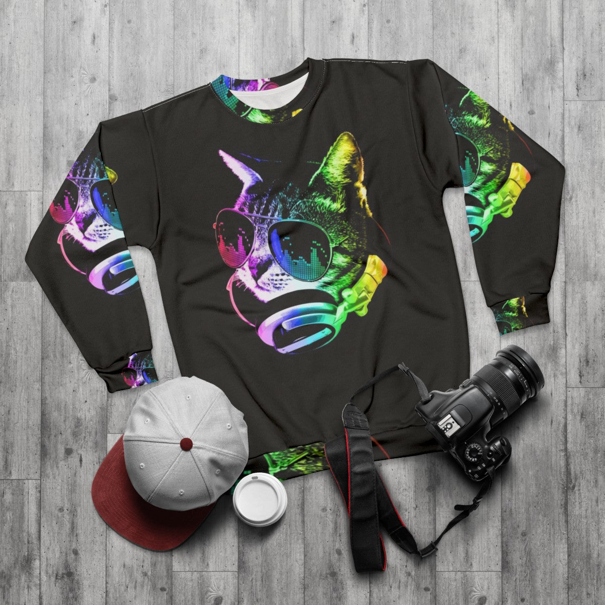 Colorful music cat sweatshirt with rainbow and headphones - flat lay