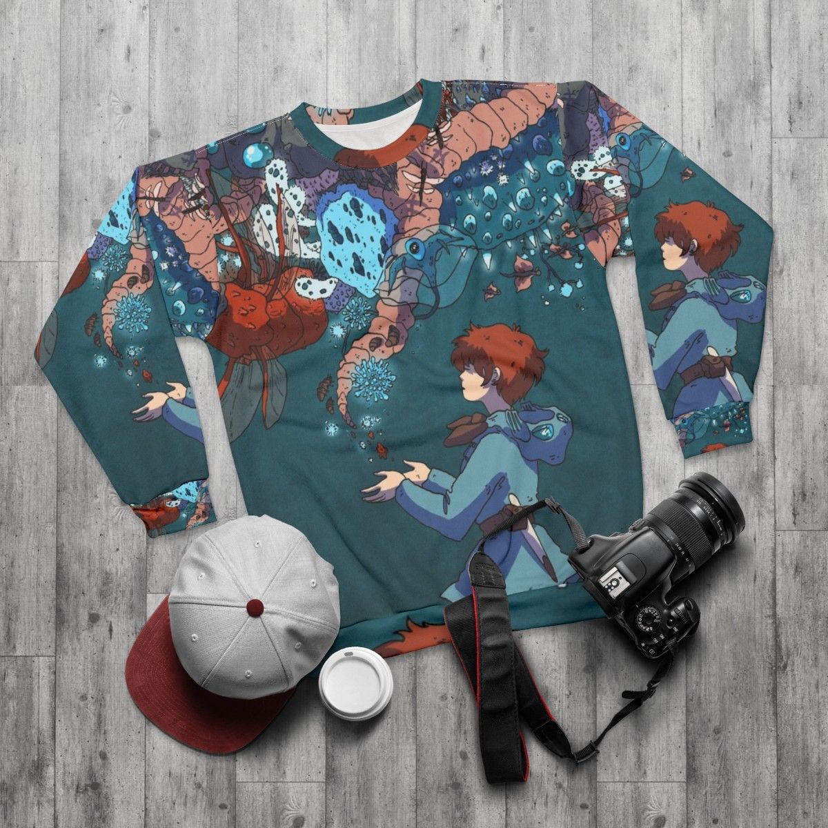 Nausicaa inspired sweatshirt with glowing insect pattern - flat lay