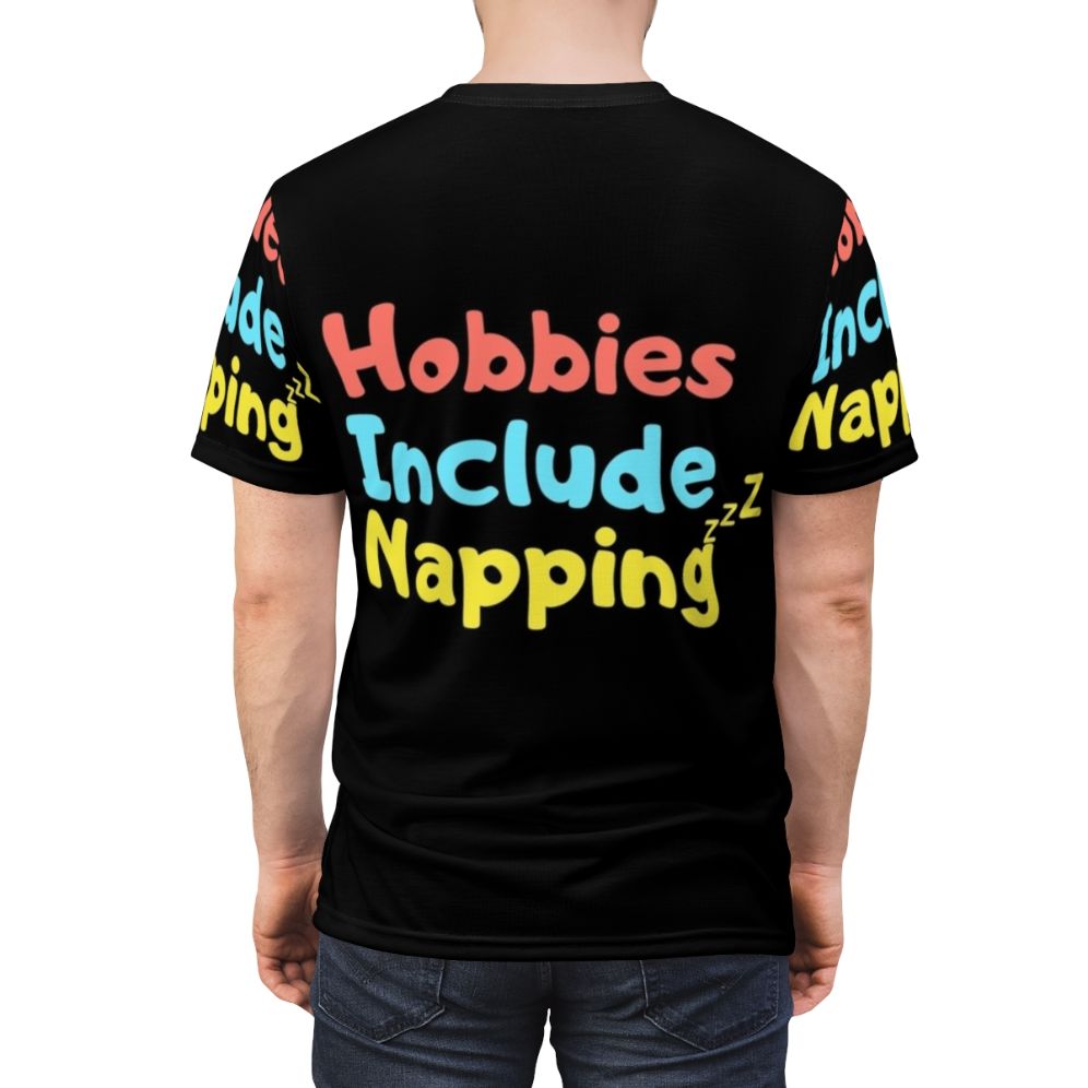 Person wearing a t-shirt with a graphic design of a person napping - men back