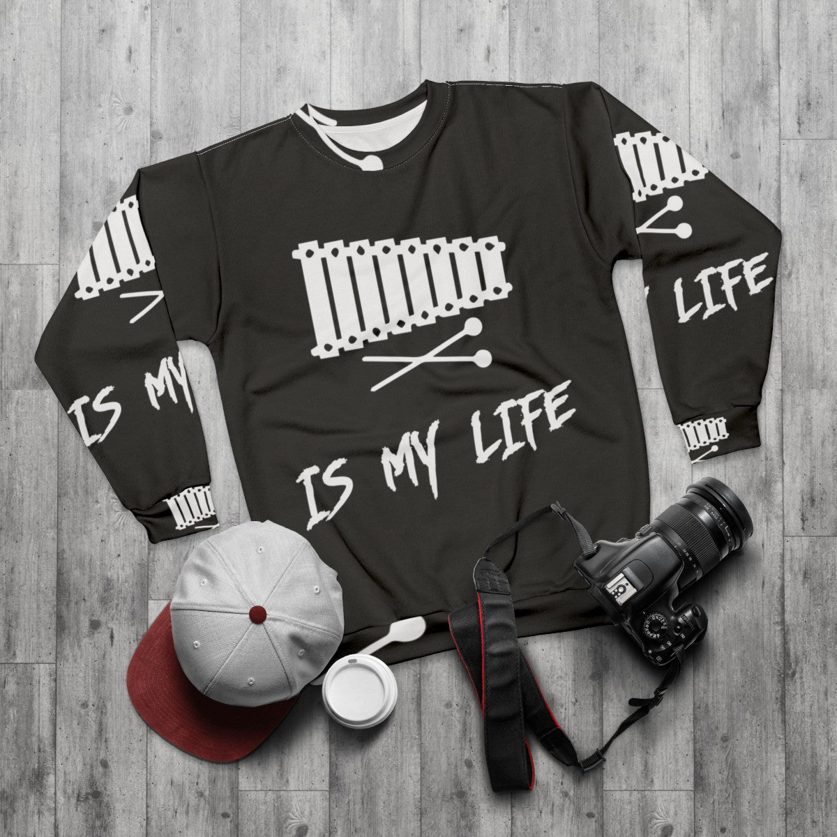 Person wearing a sweatshirt with the text "Xylophone Is My Life" - flat lay