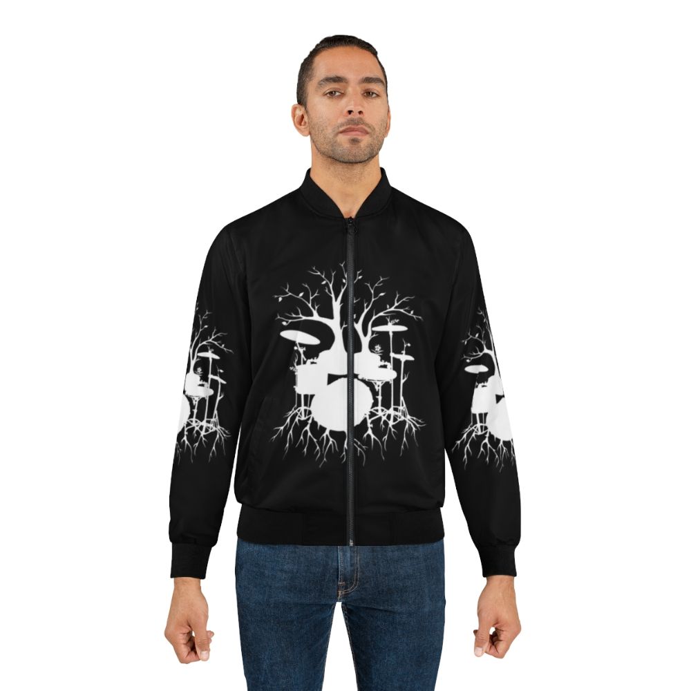 Drum tree silhouette design on a bomber jacket, featuring a surreal and symbolic tree-shaped drum set - Lifestyle