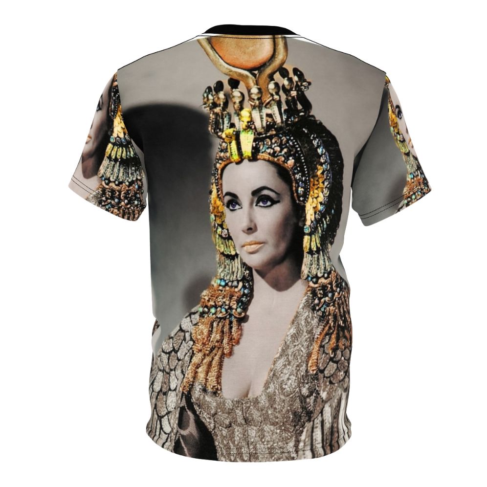 A person wearing a T-shirt featuring a stylized portrait of Elizabeth Taylor as Cleopatra in ancient Egyptian attire. - Back