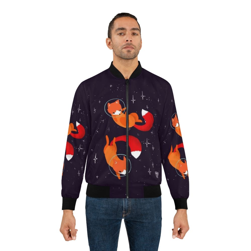 A stylish bomber jacket featuring a cute and whimsical space fox design, surrounded by stars and cosmic elements. - Lifestyle