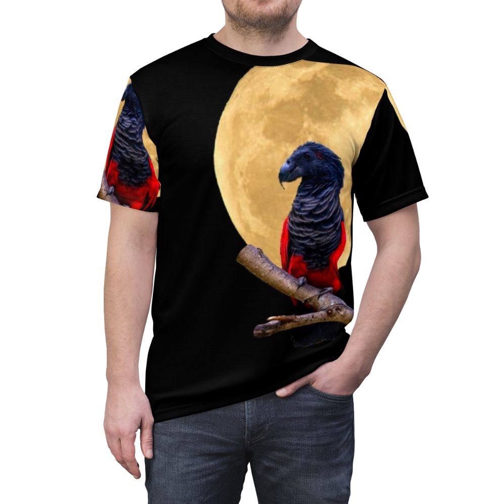 Illustration of a parrot wearing a Dracula costume against a crescent moon on a black t-shirt - men front