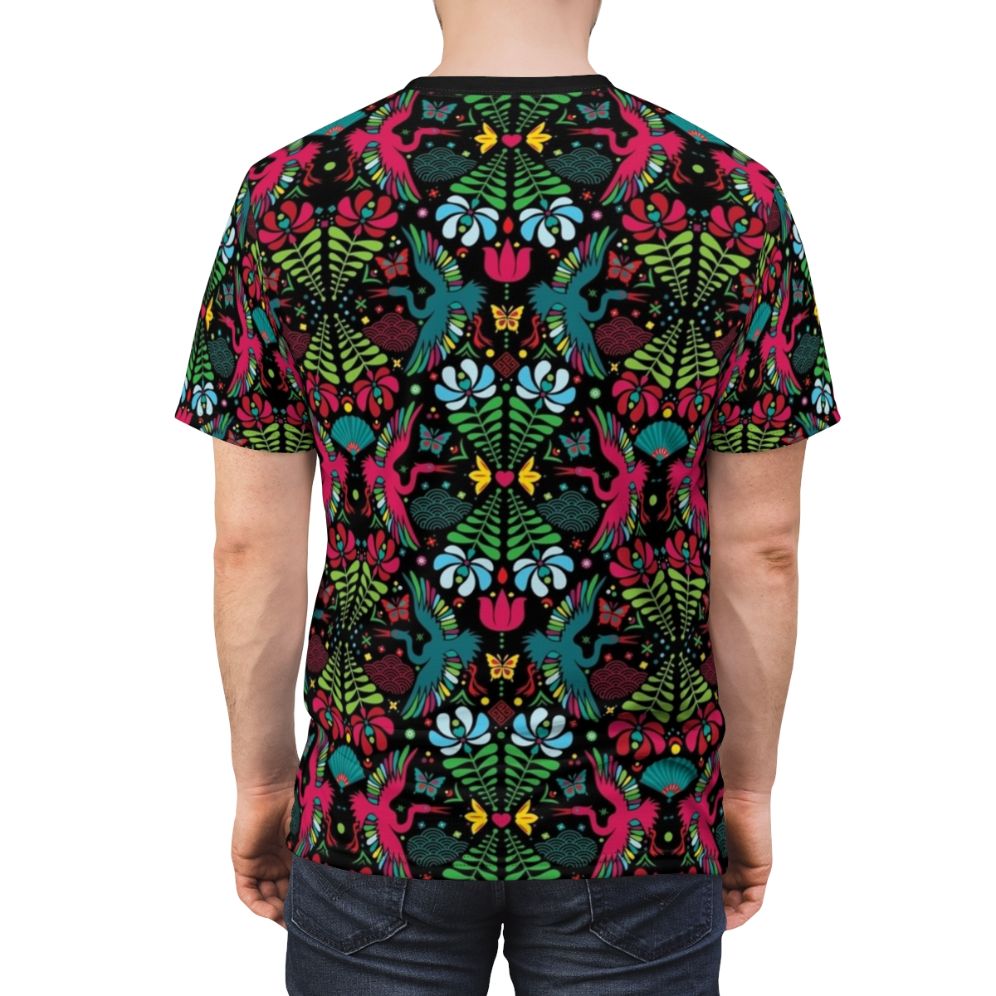 A colorful and artistic t-shirt design featuring a crane in flight amidst floral and cultural patterns - men back