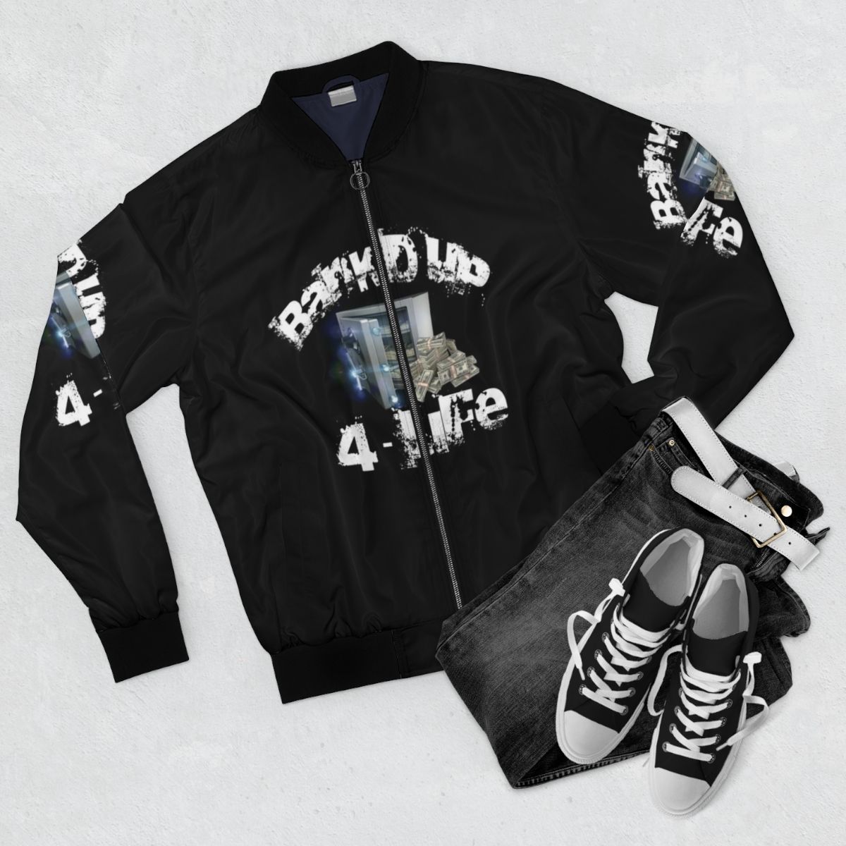 A stylish black bomber jacket with a cool streetwear design. - Flat lay