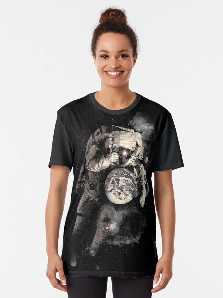 Cosmic Astronaut T-Shirt featuring a surreal graphic design of an astronaut in outer space - Women