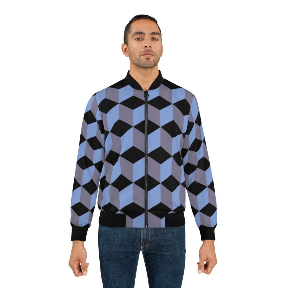 Bomber jacket with an isometric cube pattern in black, blue, and lilac colors, featuring a geometric art design with the illusion of depth. - Lifestyle