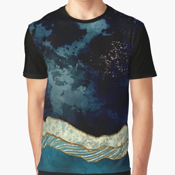 Indigo sky graphic t-shirt featuring a nature landscape design with mountains, stars, and a moon reflection on a lake.