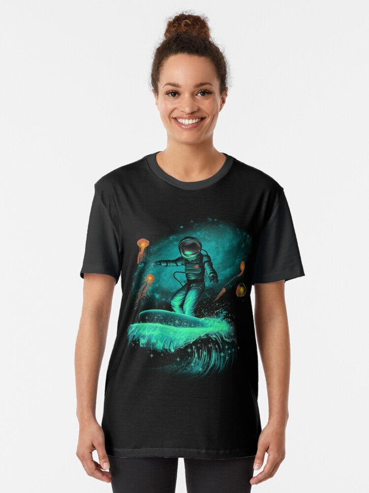 Astronaut surfing in outer space, cosmic surfer graphic t-shirt - Women