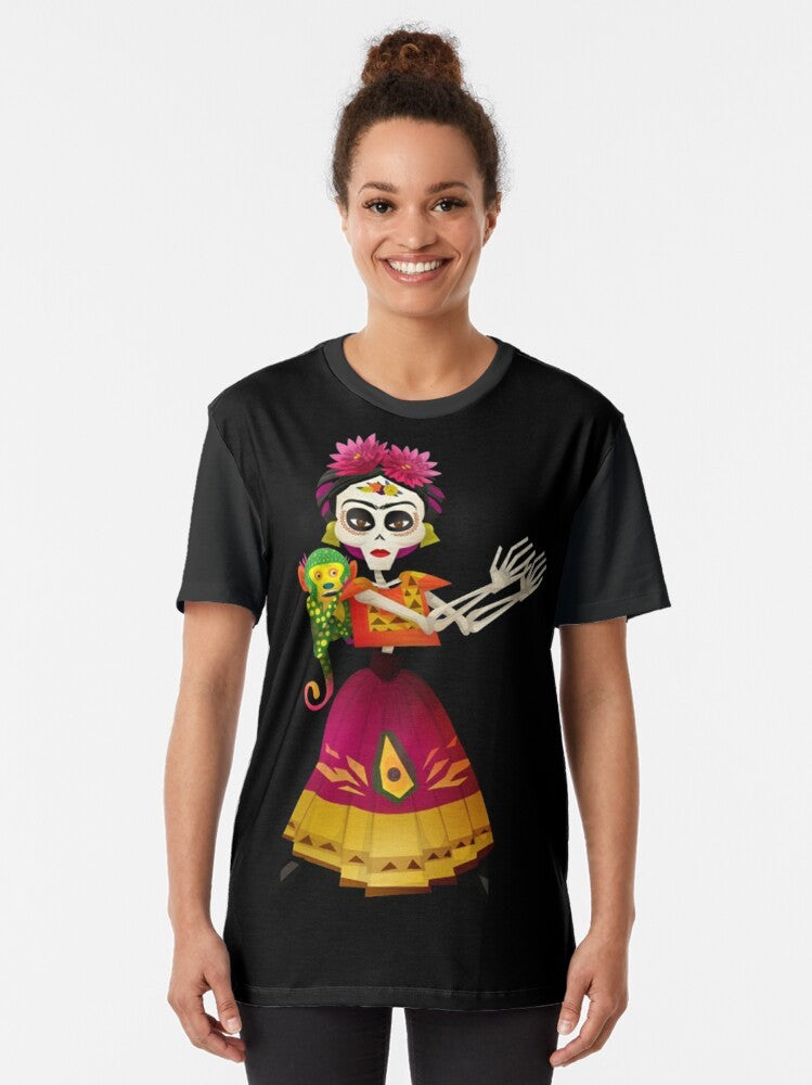 Frida Kahlo Graphic T-Shirt featuring Mexican cultural elements like skeletons, guitars, and Dia de los Muertos imagery - Women