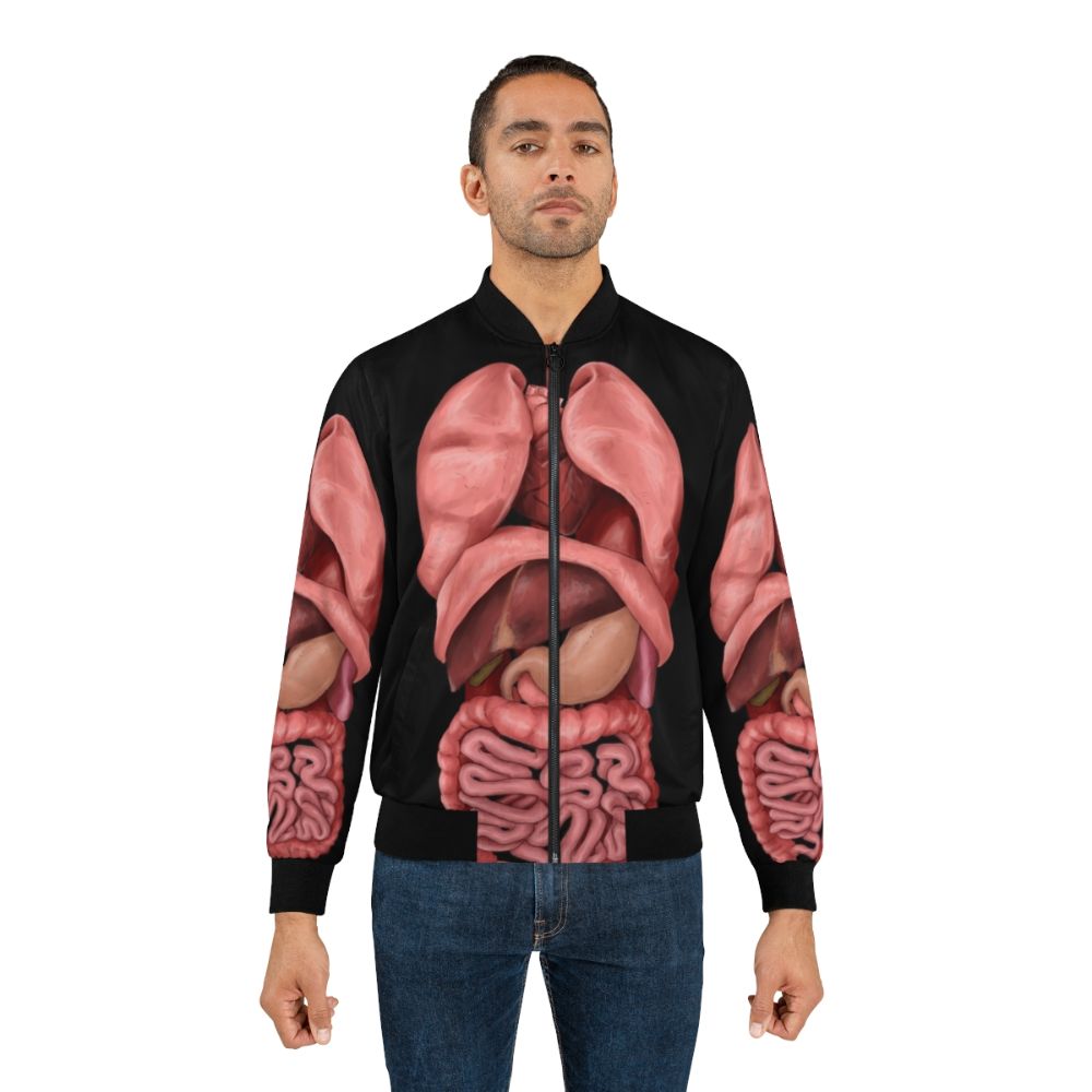 Bomber jacket featuring a detailed watercolor illustration of the human internal organs and anatomy - Lifestyle