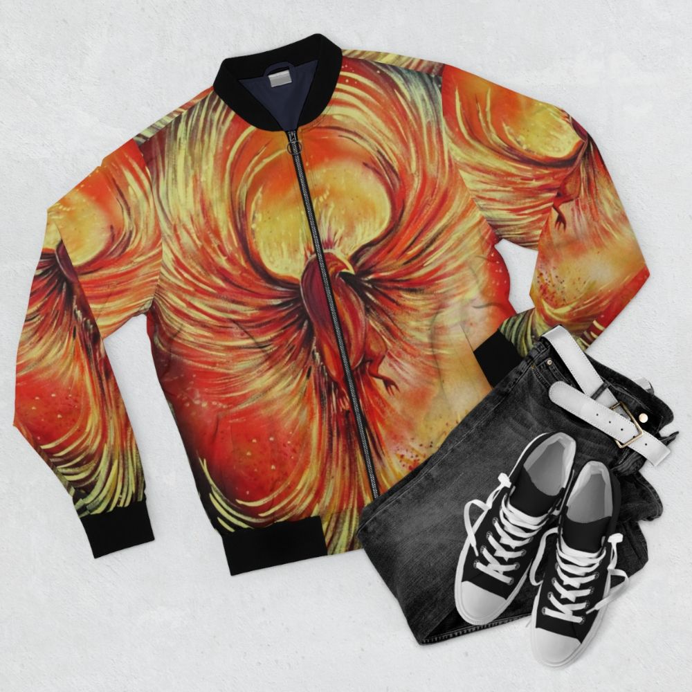 A stylish bomber jacket featuring a phoenix, a mythological bird that represents fire, rebirth, and the sun. - Flat lay