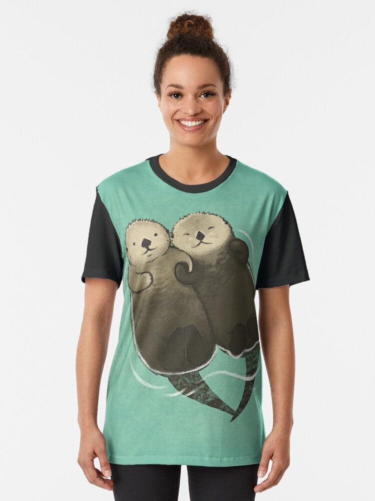 Otters holding hands graphic design on a t-shirt - Women