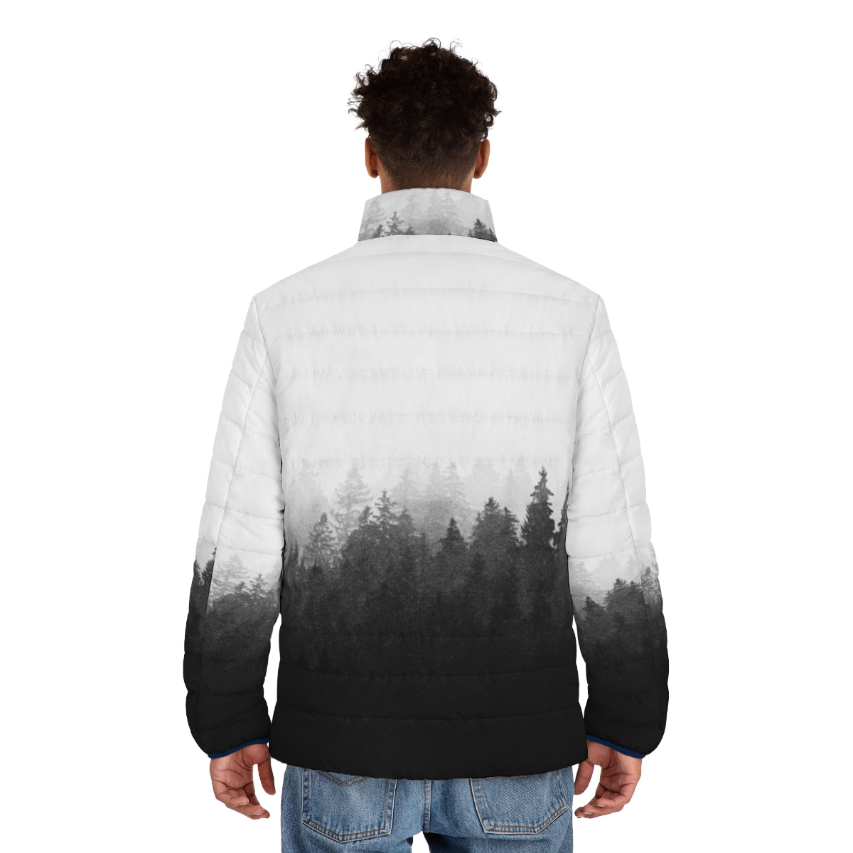 A person wearing a puffer jacket hiking through a misty forest - men back