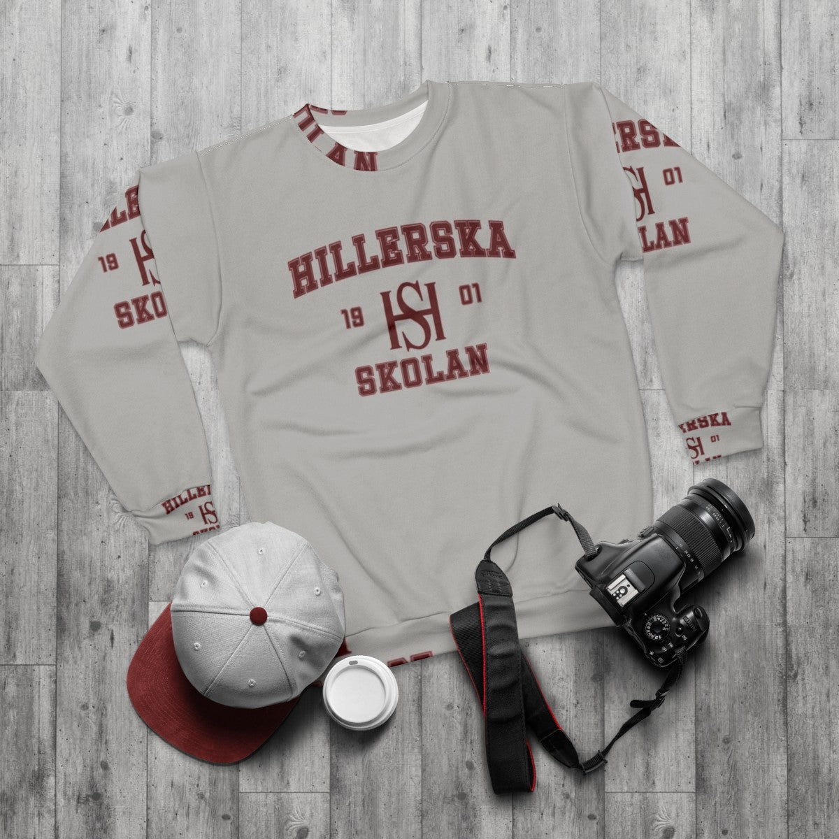 Young Royals Jersey Sweatshirt featuring the Hillerska school crest - flat lay