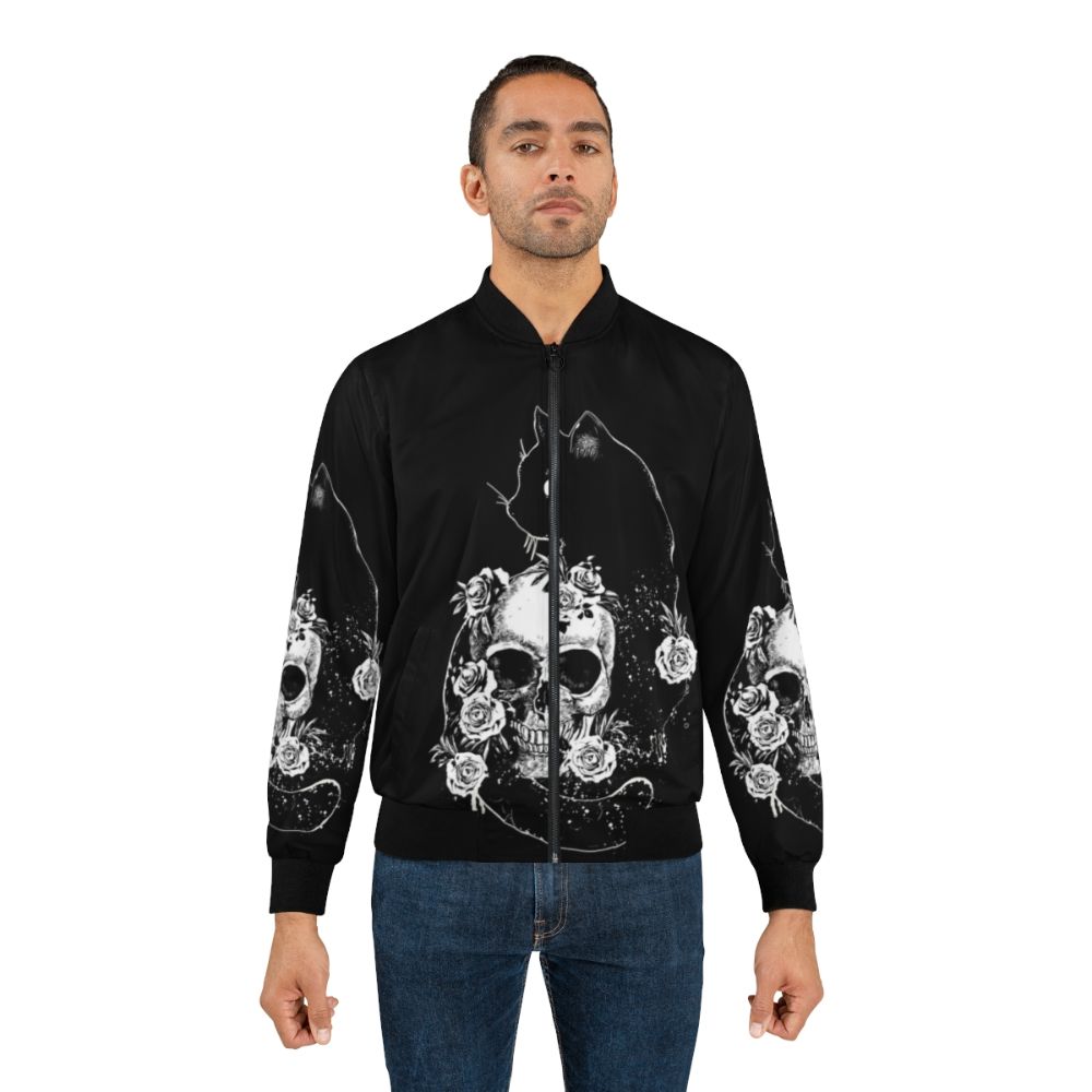 Bomber jacket with a black cat, skeleton, and bird design in a black and white drawing style. - Lifestyle