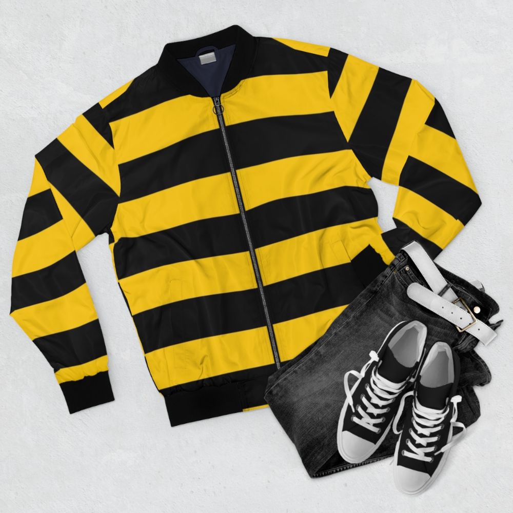 A stylish bomber jacket featuring a bee-inspired design with yellow and black stripes. - Flat lay