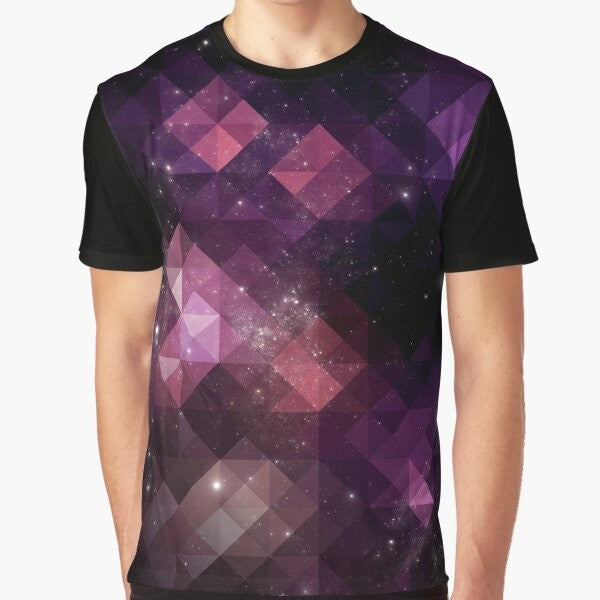 A vibrant graphic t-shirt featuring a space-inspired design with triangles, stars, and cosmic patterns in shades of pink, black, and purple.