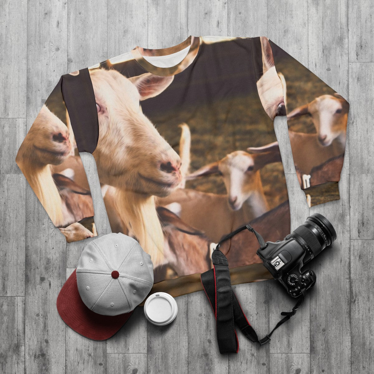 Goats and farm animals printed on a black sweatshirt - flat lay