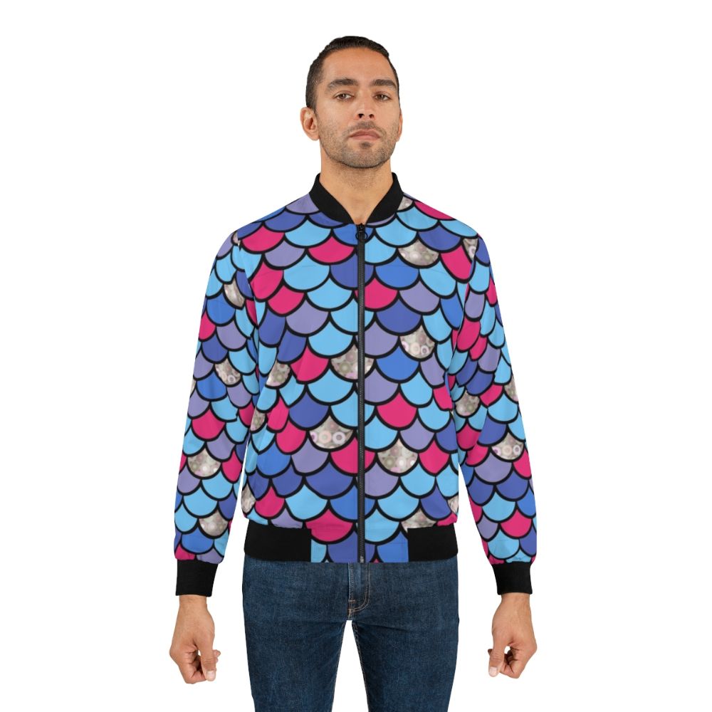 A vibrant bomber jacket with a printed design of rainbow fish scales, perfect for young children. - Lifestyle